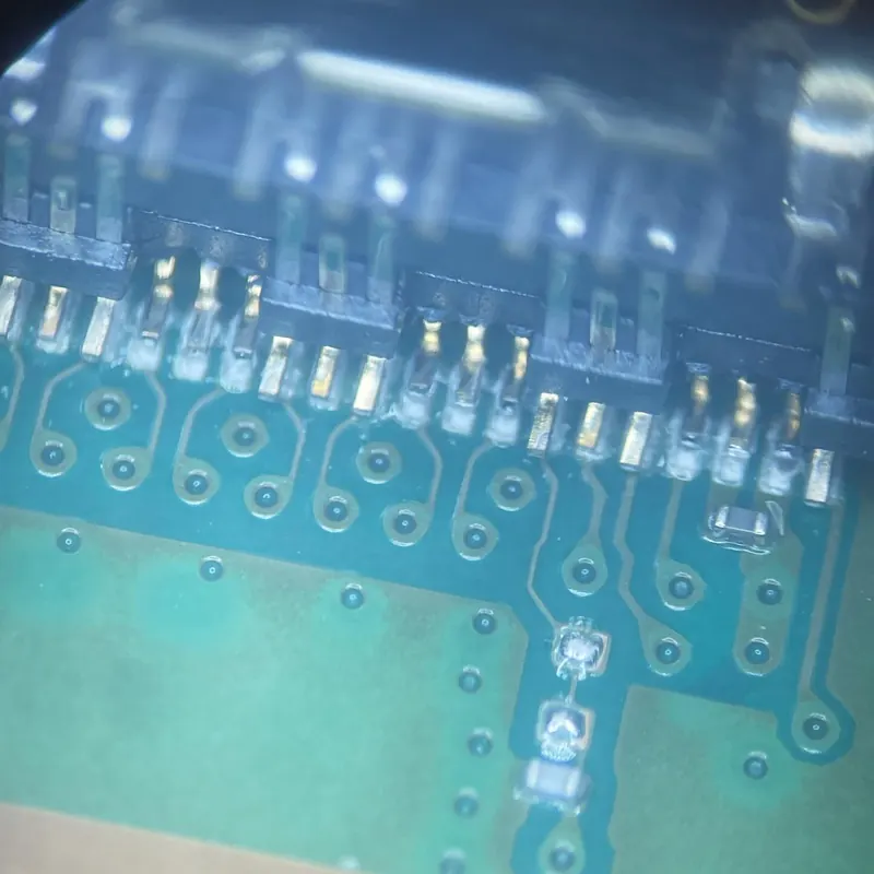Circuit board connections inspected under the microscope after micro-soldering